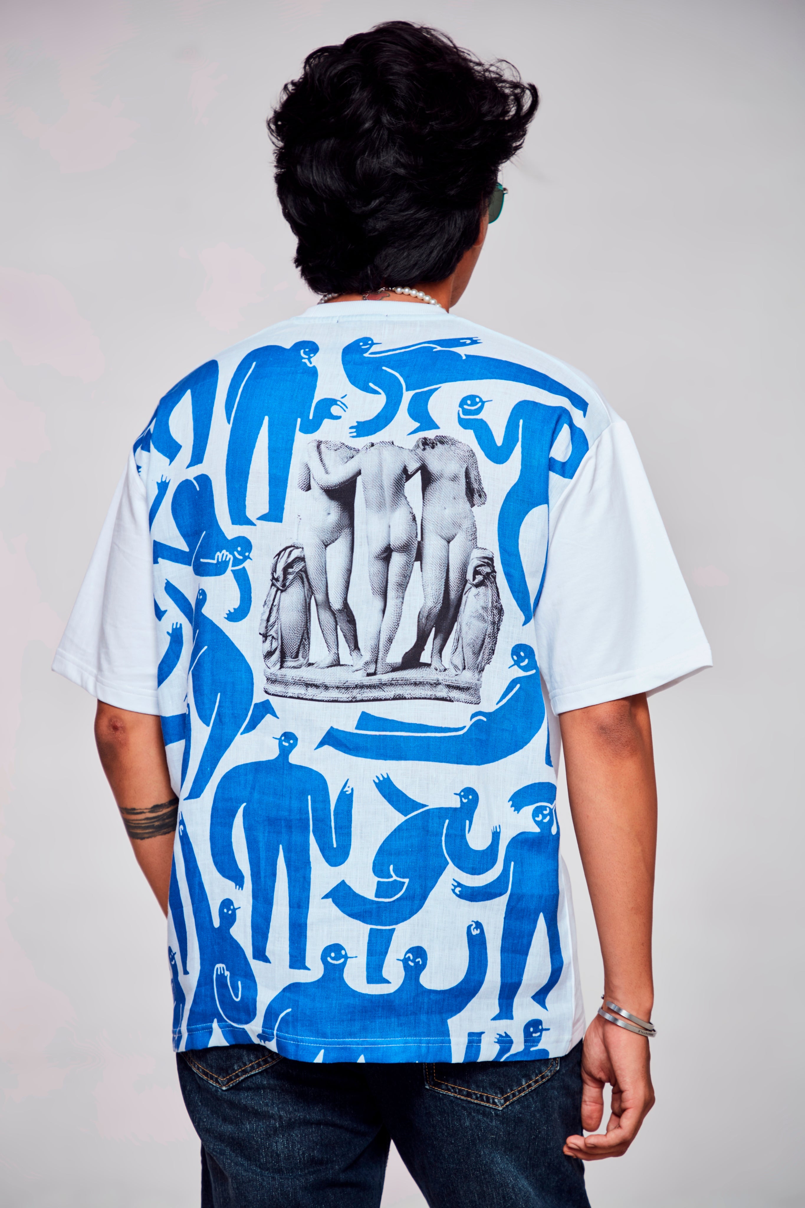 Whimsical Charm : Illuminating Blue Canvas with the Enigmatic Lady - Oversize Linen Tshirt